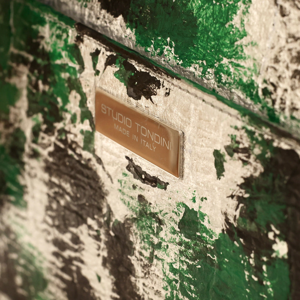 Back detail of the metallic Studio Tondini Made in Italy plaque on The Cristiana “Piece of My Heart”, highlighting refined finishing and contemporary Italian craftsmanship.