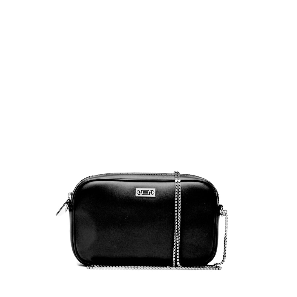 Front view of The Valentina Bag in black leather highlighting compact proportions, polished palladium-plated hardware, and understated contemporary elegance.