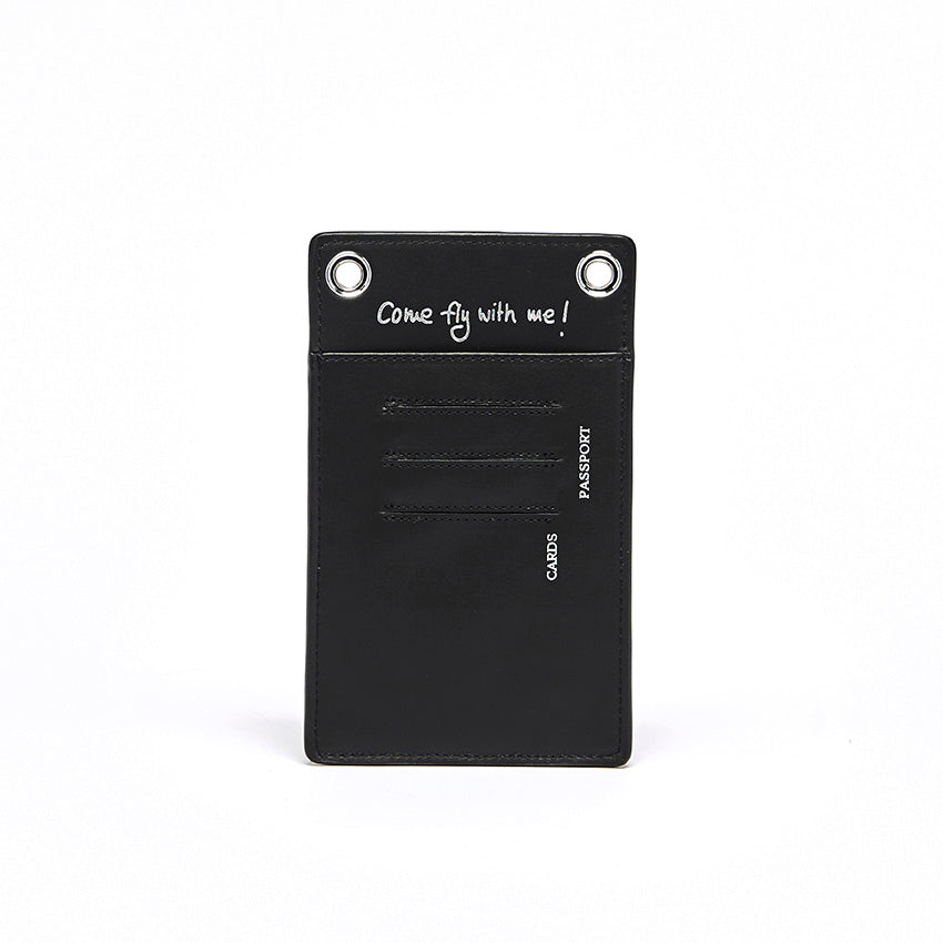 The Come Fly With Me! in Black. Back view showing smooth Italian leather with punched cursive inscription “Come Fly with Me!” and external slots for cards and passport.