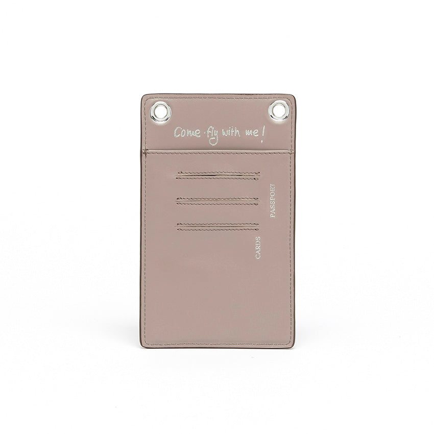 The Come Fly With Me! in Light Grey. Back view showing smooth Italian leather with punched cursive inscription “Come Fly with Me!” and external slots for cards and passport.