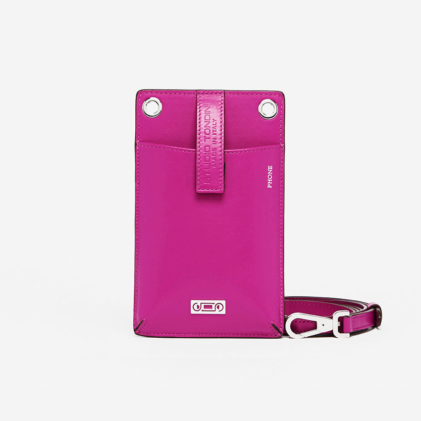 The Come Fly With Me! in Orchid. Front view showing smooth Italian leather, compact crossbody silhouette with external phone pocket and sturdy brass hardware plated in palladium.