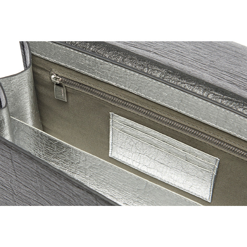 The Cristiana Vegan Shoulder Bag by Studio Tondini. Interior view of the black version, revealing structured compartments lined in cotton and silver Piñatex® - refined, functional, and consciously crafted.