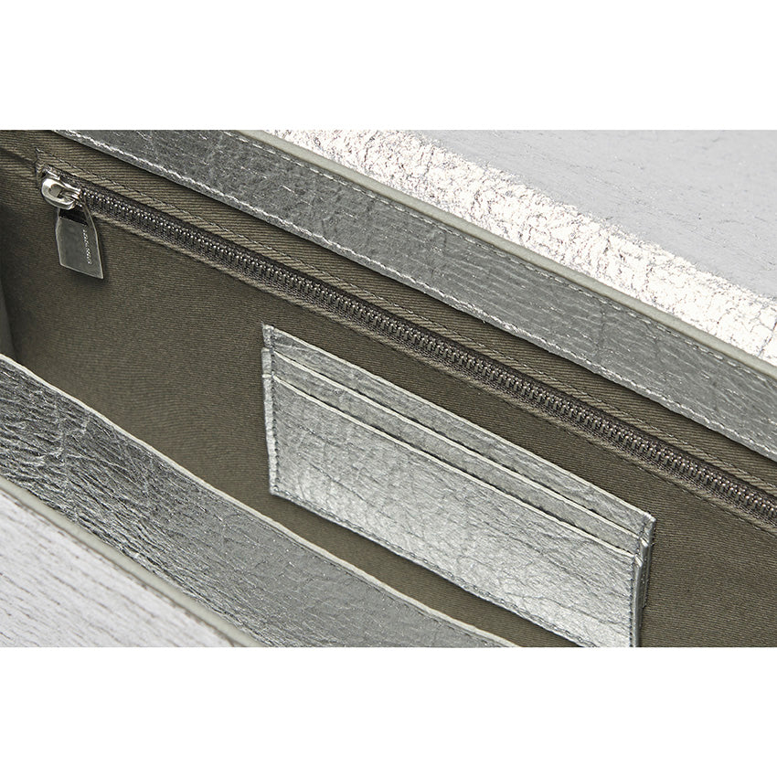 The Cristiana Vegan Shoulder Bag by Studio Tondini. Interior view of the silver version, revealing structured compartments lined in cotton and Piñatex® - refined, functional, and consciously crafted.