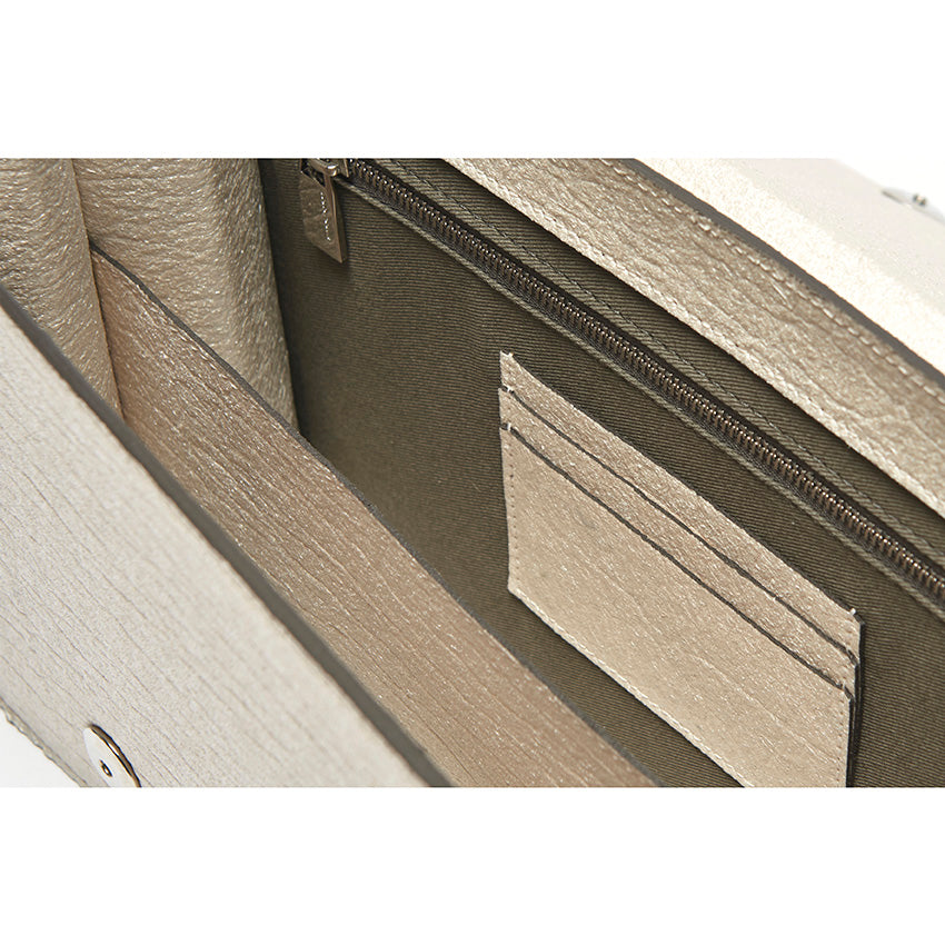 The Cristiana Vegan Shoulder Bag by Studio Tondini. Interior view of the pearled white version, revealing structured compartments lined in cotton and Piñatex® - refined, functional, and consciously crafted.