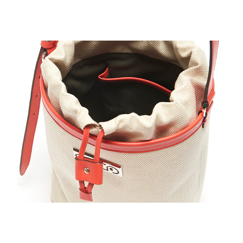 Interior of The Francesca Canvas Bucket Bag. Smartphone pocket, card slots, key clip leash, and spacious cotton drill-lined interior.