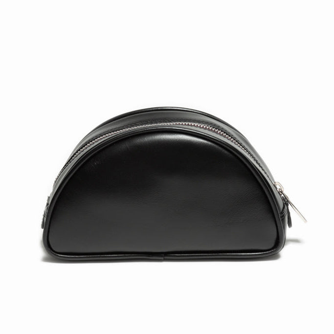 The Valentina Toiletry by Studio Tondini. Back view of black handcrafted leather pouch, discreet and elegant.