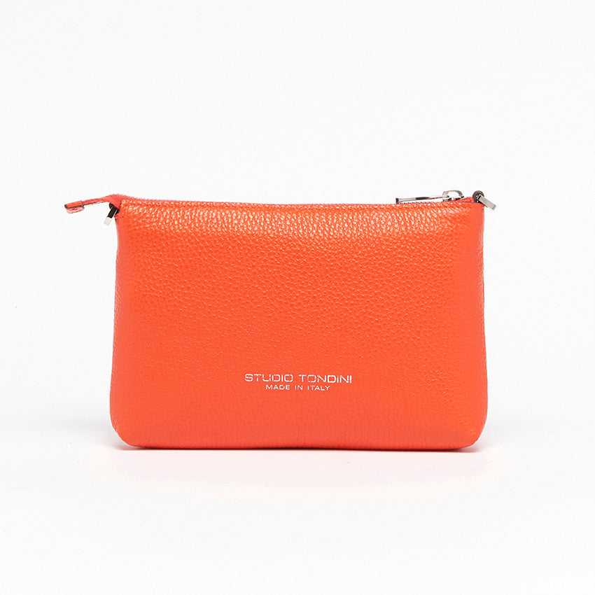 Back view of The Arianna Monochrome Pouch in Coral grained leather with minimalist construction and refined Italian craftsmanship.