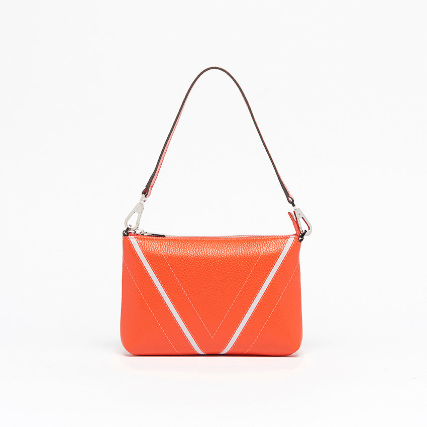 Front view of The Arianna Monochrome Pouch in Coral grained leather with signature V-shaped detailing and refined contemporary Italian craftsmanship.