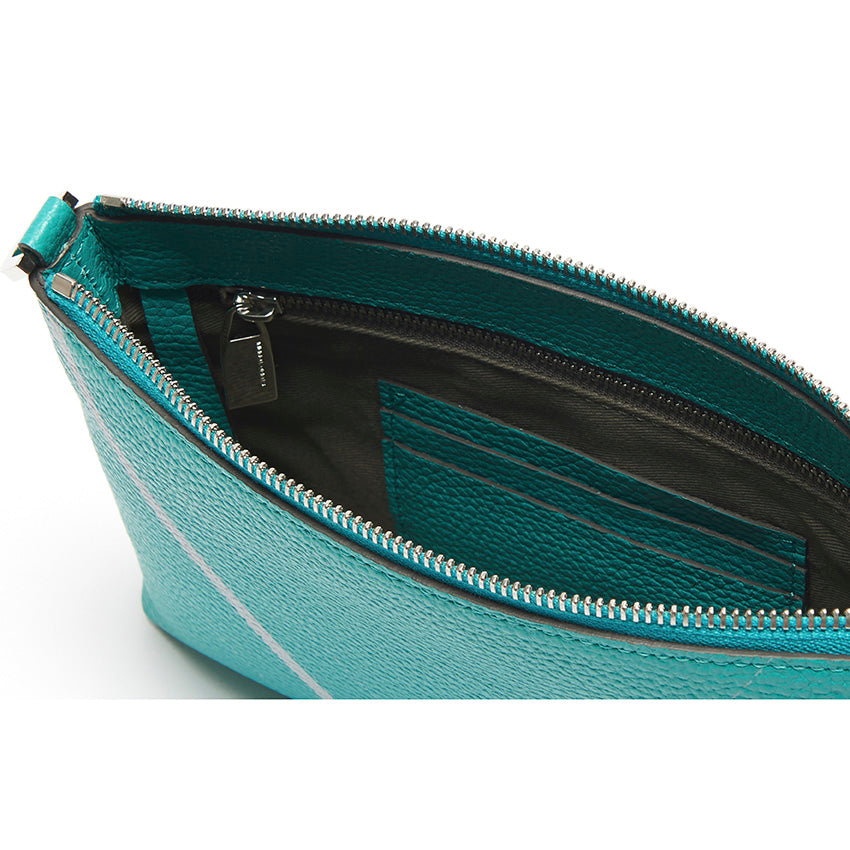 Interior detail of The Arianna Monochrome Pouch in Emerald grained leather highlighting organised compartments, refined zip construction, and thoughtful contemporary functionality.