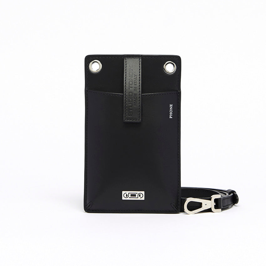 Front view of The Come Fly with Me! in black leather with refined proportions, compact structure, and understated contemporary elegance crafted in Italy.