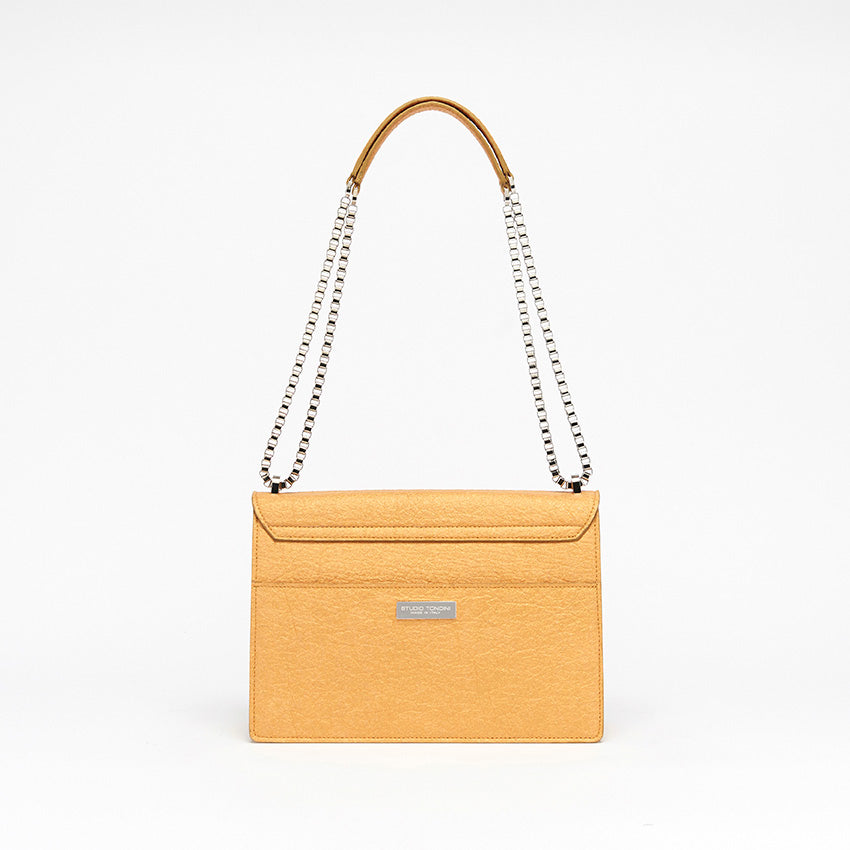 Back view of The Cristiana Vegan Shoulder Bag in Antique Gold Piñatex with clean architectural lines, tactile texture, and understated contemporary elegance crafted in Italy.