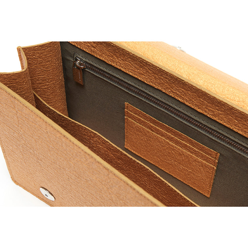 Interior detail of The Cristiana Vegan Shoulder Bag in Antique Gold Piñatex showing thoughtful organisation and composed contemporary craftsmanship.