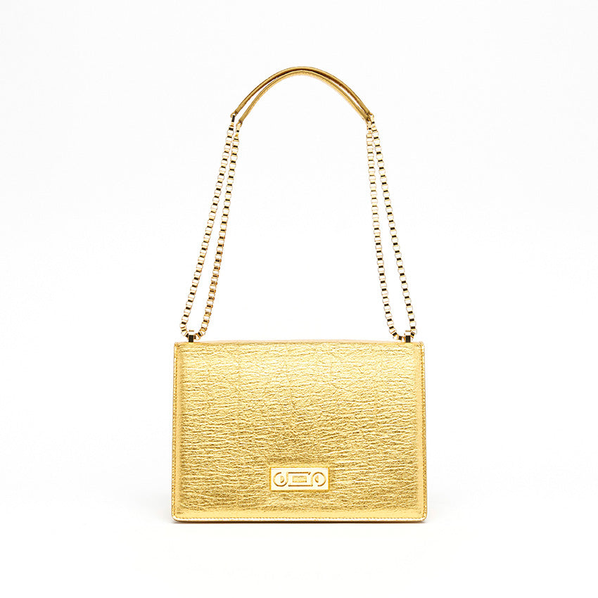 Front view of The Cristiana Vegan Shoulder Bag in gold Piñatex with sculptural proportions, tactile texture, and 24K gold-plated chain hardware crafted in Italy.
