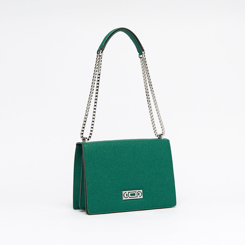 Three-quarter view of The Cristiana Vegan Shoulder Bag in green Piñatex featuring refined proportions and polished Italian craftsmanship.