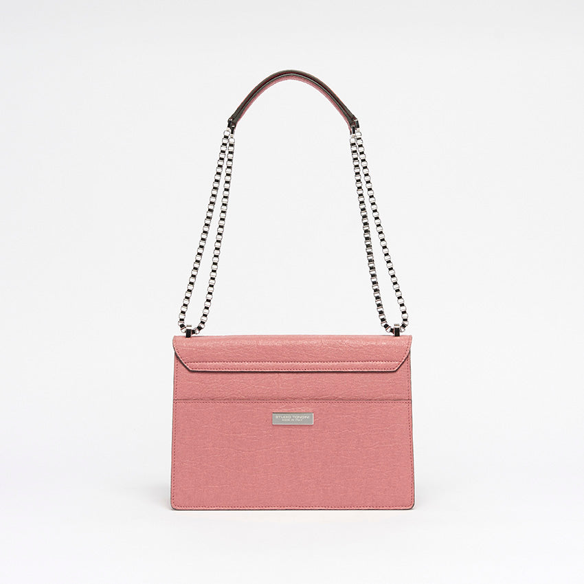 Back view of The Cristiana Vegan Shoulder Bag in pink Piñatex with understated lines and elegant minimalist geometry.