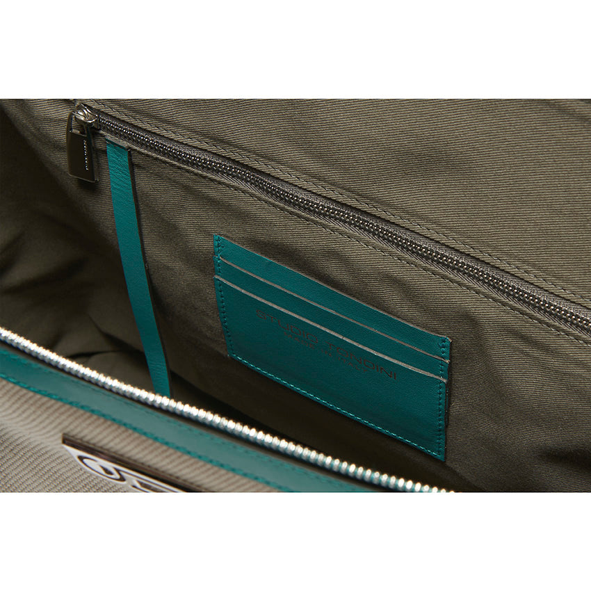 Interior detail of The Giulia Canvas Tote Bag highlighting organised compartments, tactile canvas lining, and thoughtful contemporary functionality.