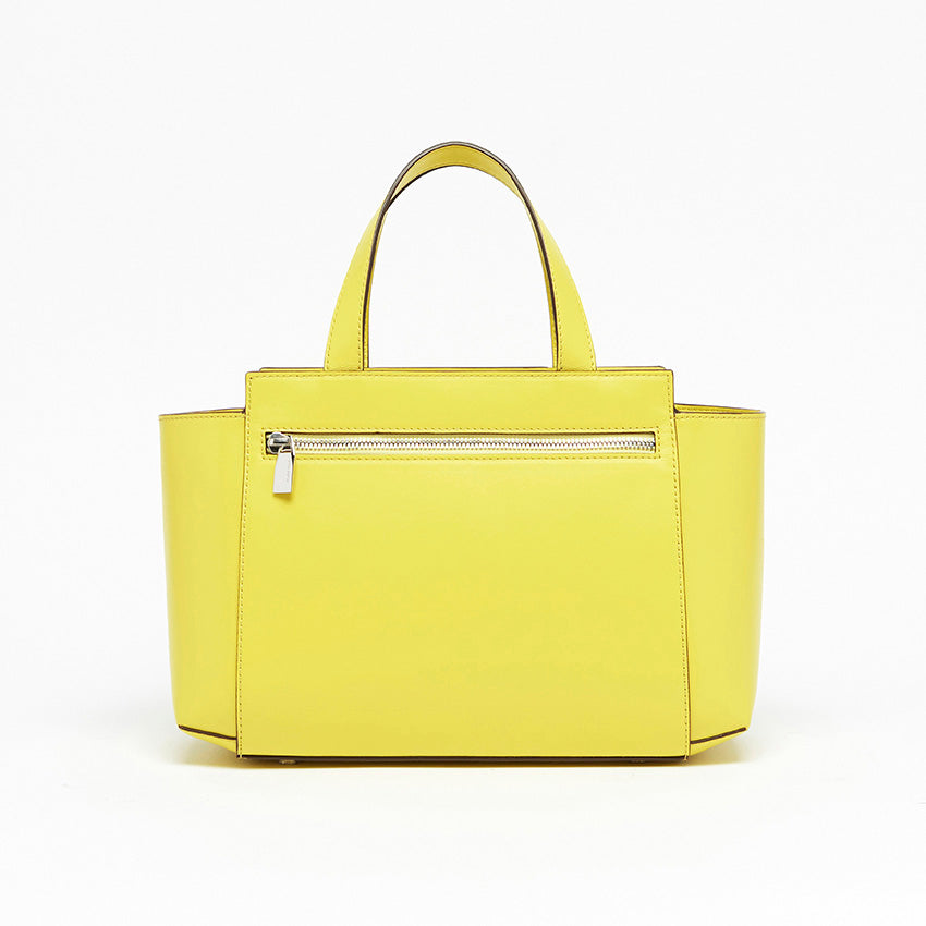 Back view of The Maja Little Tote Bag in Yellow Lime leather featuring clean architectural lines and understated contemporary elegance.