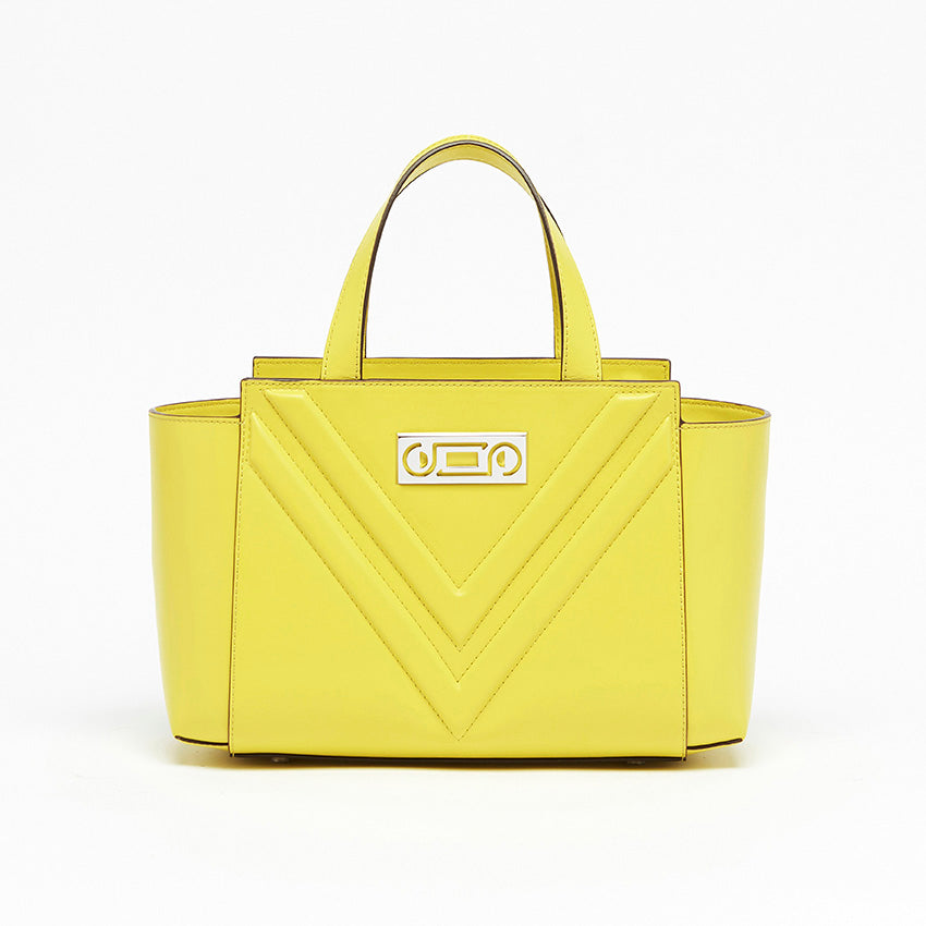 Front view of The Maja Little Tote Bag in Yellow Lime leather with signature V-shaped detailing and sculptural structured silhouette crafted in Italy.