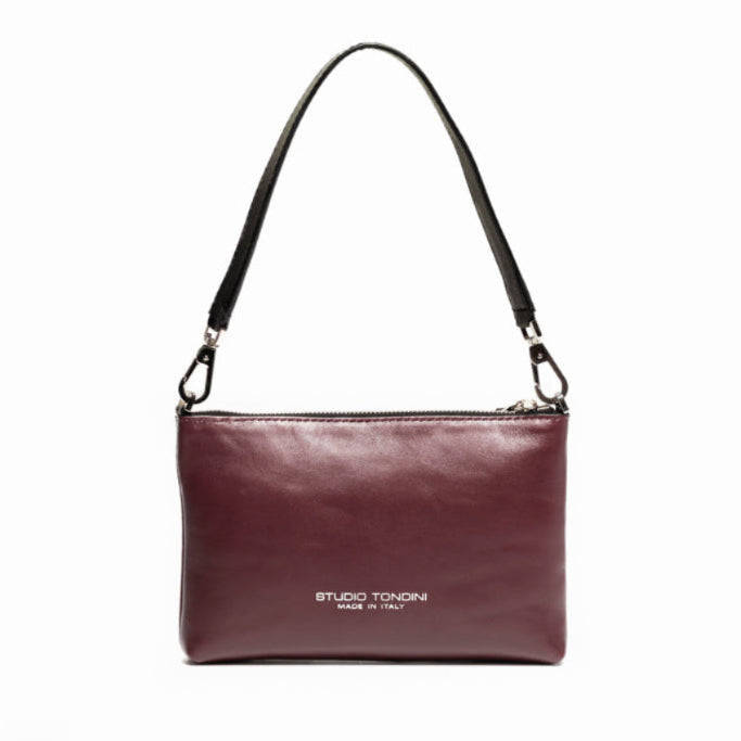 Back view of The Arianna Pouch in smooth bordeaux leather with minimalist construction and elegant contemporary lines.