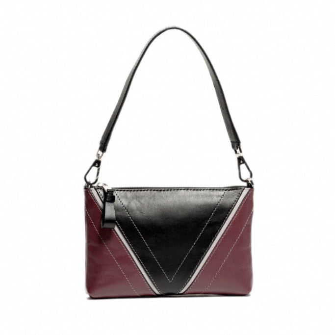 Front view of The Arianna Pouch featuring Studio Tondini’s signature V-shape construction, creating a black leather triangle on smooth bordeaux leather.