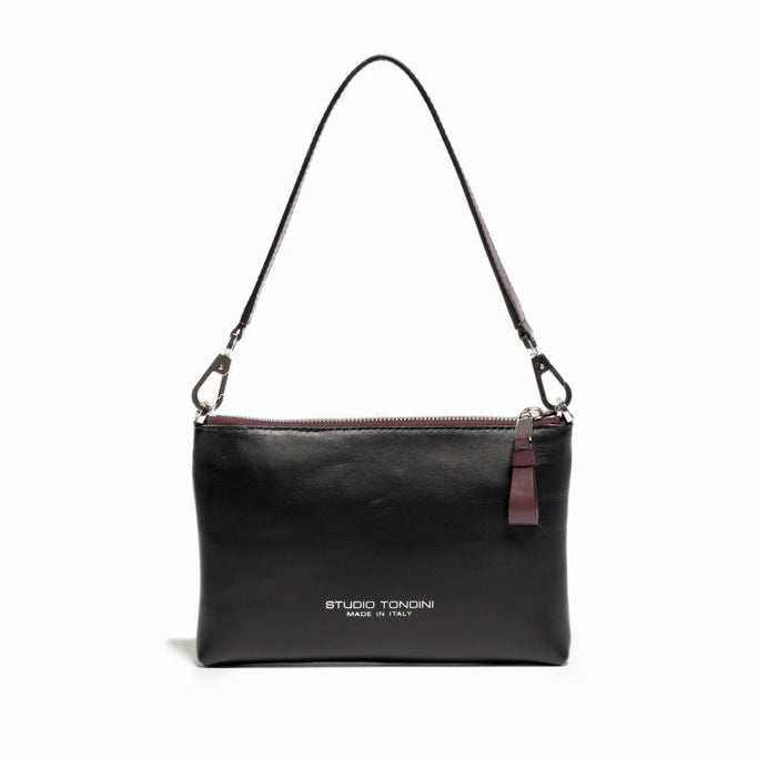 Back view of The Arianna Pouch in smooth black leather with minimalist construction and elegant contemporary lines.