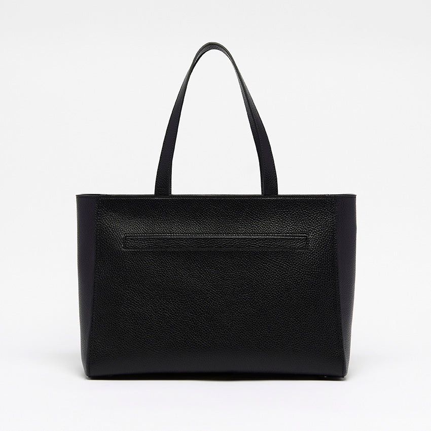 Back view of The Maja Monochrome Tote Bag in black pebbled leather with clean architectural lines and minimalist construction.