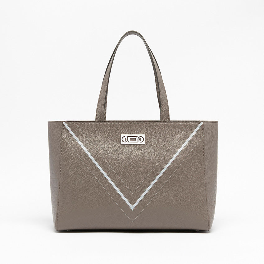 Front view of The Maja Monochrome Tote Bag in taupe pebbled leather, featuring Studio Tondini’s signature geometric V-shape and refined palladium-plated hardware.