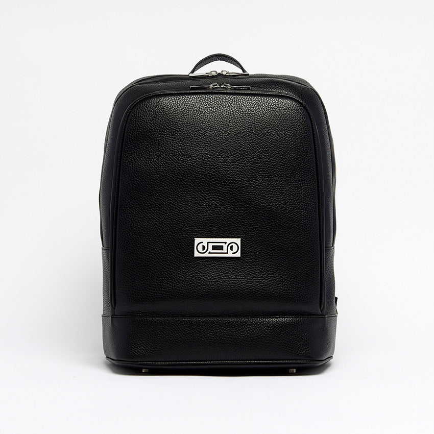 Front view of The Simona Monochrome Backpack in black pebbled leather, featuring minimalist lines and refined palladium-plated hardware.