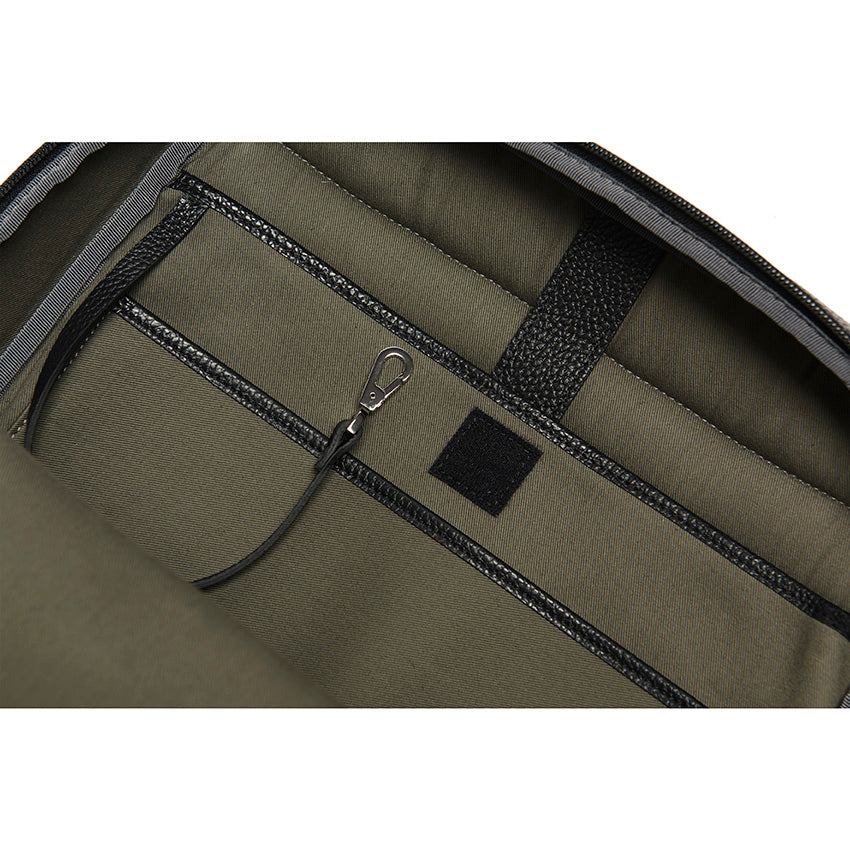 Close-up detail of The Simona Monochrome Backpack interior construction in black pebbled leather and cotton lining.